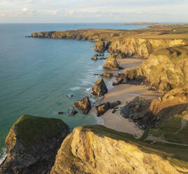 Aerial view of Bedruthan steps during sunset at lowtide, Cornwall, United Kingdom. - AAEF17911