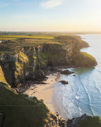 Aerial view of Bedruthan steps during sunset at lowtide, Cornwall, United Kingdom. - AAEF17914