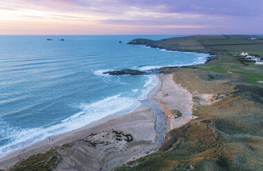 Aerial view of the coastline at Constantine Bay at sunset, Cornwall, United Kingdom. - AAEF17920