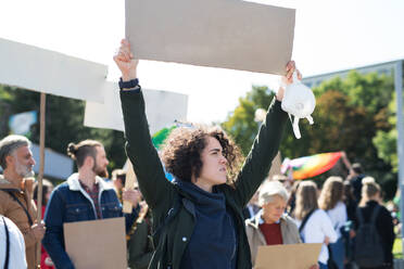 Black lives matters protesters holding signs and marching outdoors in city streets. - HPIF14419