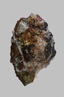 Close up detail textured multicolored German chalcopyrite stone on gray background - FSIF06315