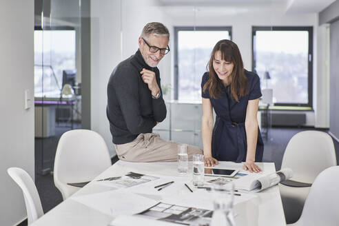 Two creative business colleagues working on a project in office - RORF03568