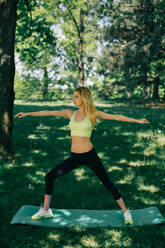 Young woman exercising in park - ADSF44319