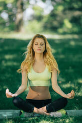 Young woman exercising in park - ADSF44320