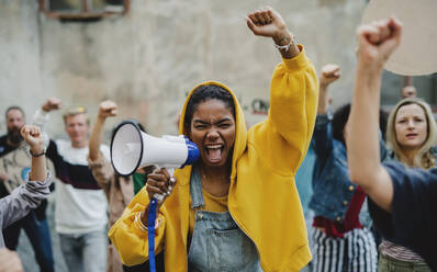 Front view of group of people activists protesting on streets, BLM demonstration and coronavirus concept. - HPIF17115