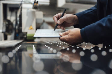 Businessman using tablet PC at industry - JOSEF19319