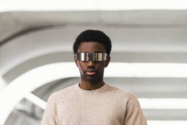 Cool young man wearing cyber glasses, portrait - PNAF05340