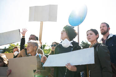 People with placards and posters on a global strike for climate change. - HPIF19195