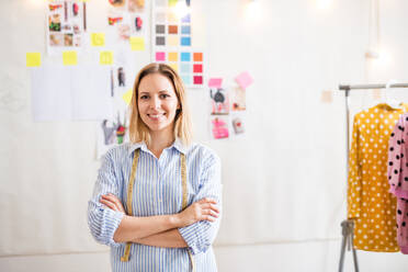 Young creative woman working in a studio, startup business. - HPIF19559