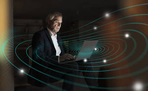 Digital composite image of senior businessman using laptop with futuristic network - UUF28765