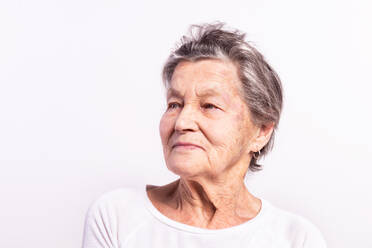 Portrait of a senior woman in studio. Close up. - HPIF21073