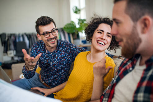 A group of young cheerful friends talking indoors at home, house sharing concept. - HPIF21919