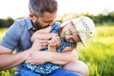 Father with a small daughter having fun in sunny spring nature. - HPIF22603