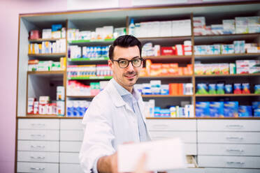 Portrait of a young atrractive friendly male pharmacist. - HPIF22995