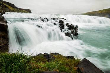 A waterfall in a beautiful Iceland landscape, Europe. - HPIF29600