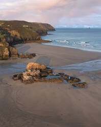 Aerial view of Chapel Rock seapool at sunrise, Perranporth, Cornwall, United Kingdom. - AAEF18190