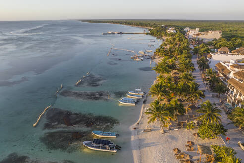 Aerial view of boats moored along the coast on the beach in Mahahual, a small town along the coastline, Quintana Roo, Mexico. - AAEF18287