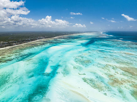 Aerial view of white coral sand of a blue lagoon at low tide, Paje, Jambiani, Zanzibar, Tanzania, East Africa, Africa - RHPLF24209