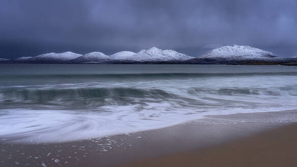 Winter at Luskentyre beach with snow capped mountains, Isle of Harris, Outer Hebrides, Scotland, United Kingdom, Europe - RHPLF24311