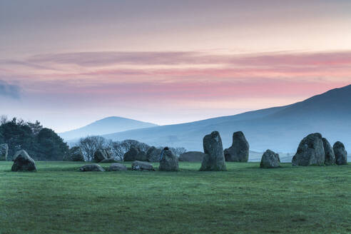 Sunrise over Castlerigg and St. John's in the Vale near Keswick, Lake District National Park, UNESCO World Heritage Site, Cumbria, England, United Kingdom, Europe - RHPLF24326