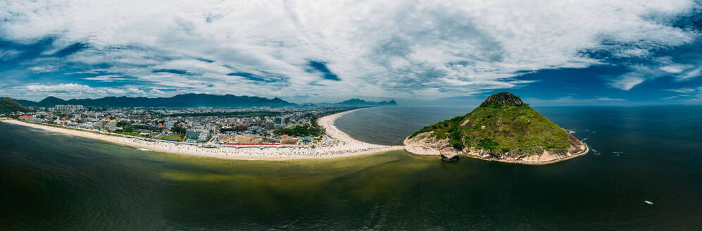 Aerial panoramic view of Pedra do Pontal, which divides Praia de Sernambetiba and Praia do Recreio, Rio de Janeiro, Brazil, South America - RHPLF24335