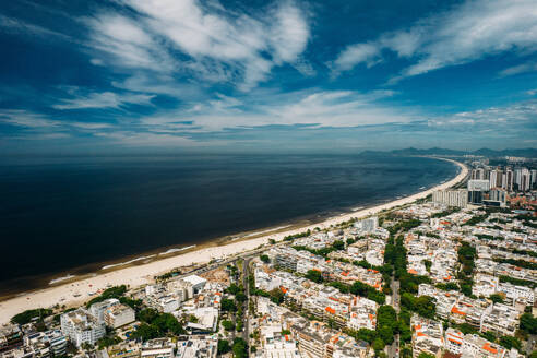 Aerial panoramic view of Barra da Tijuca district, and long sandy beach, a western neighborhood, Rio de Janeiro, Brazil, South America - RHPLF24336