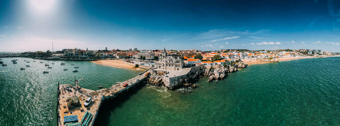 Aerial drone panoramic view of Cascais historic centre with the iconic Bay and Ribeira Beach, 30km west of Lisbon on the Portuguese Riviera, Cascais, Portugal, Europe - RHPLF24340