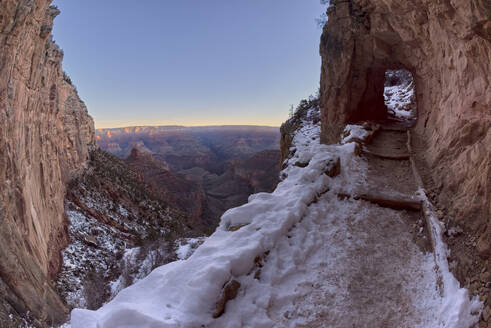 The second tunnel along Bright Angel Trail in winter at sunrise on the South Rim of Grand Canyon, Grand Canyon National Park, UNESCO World Heritage Site, Arizona, United States of America, North America - RHPLF24350