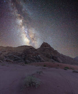 Milky Way core rising over a peak in the Wadi Rum desert, Jordan, Middle East - RHPLF24385