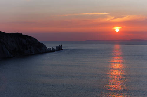 Sunset over The Needles from Alum Bay, Isle of Wight, England, United Kingdom, Europe - RHPLF24587