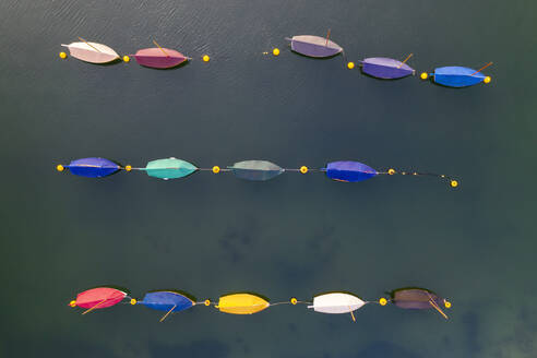 Aerial image of colourful boats moored in a harbour, Cornwall, England, United Kingdom, Europe - RHPLF24594