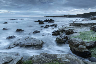 Twilight over the rocky shores of Swine Den near Howick, Northumberland, England, United Kingdom, Europe - RHPLF24616