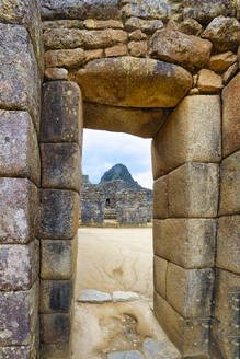 Machu Picchu, UNESCO World Heritage Site, gate in the ruined city of the Incas with the Mount Huayana Picchu, Andes Cordillera, Urubamba province, Cusco, Peru, South America - RHPLF24699