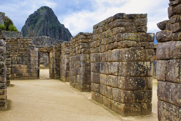 Machu Picchu, UNESCO World Heritage Site, gate in the ruined city of the Incas with the Mount Huayana Picchu, Andes Cordillera, Urubamba province, Cusco, Peru, South America - RHPLF24701