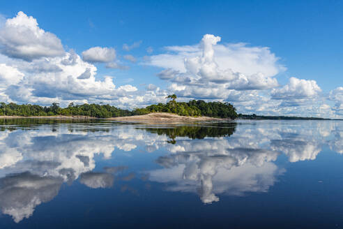 Clouds reflecting in the Rio Negro, southern Venezuela, South America - RHPLF24720