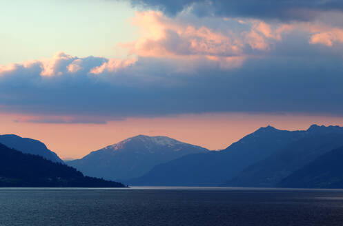 Mountains at dawn above Nordfjorden in Oldedalen Valley, near Olden, Vestland, Norway, Scandinavia, Europe - RHPLF24784