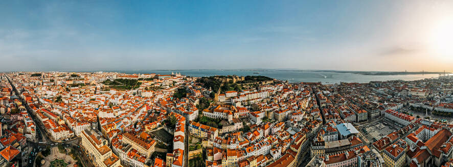Aerial drone view of Baixa District, facing south towards the Tagus River with the major landmarks visible including St. George Castle, Pantheon, Figueira, Rossio Square, Martim Moniz Squares, Lisbon, Portugal, Europe - RHPLF24832