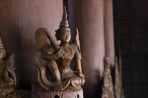 Wooden Buddha statue decoration inside wooden temple, Shwenandaw Temple, Mandalay, Myanmar (Burma), Asia - RHPLF24886