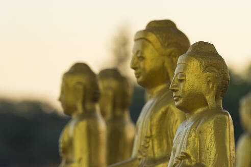 Gilded statues at Myo Yar Pyae Pagoda, Monywa, Myanmar (Burma), Asia - RHPLF24895