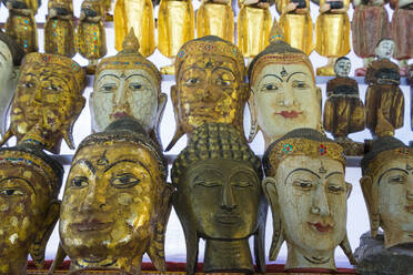 Buddha masks on display at shop, Mandalay, Myanmar (Burma), Asia - RHPLF24915