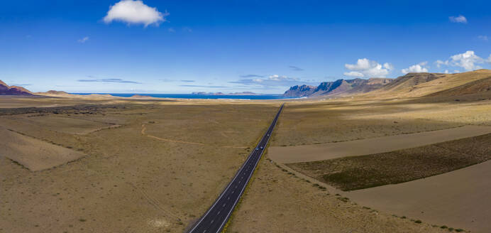 Aerial view of road to Caleta de Famara, Lanzarote, Las Palmas, Canary Islands, Spain, Atlantic, Europe - RHPLF25041