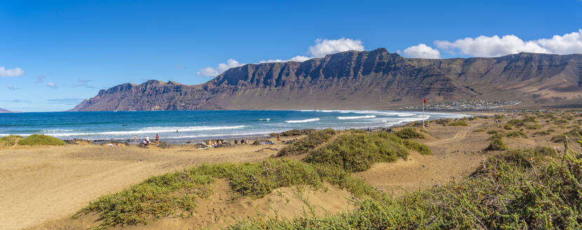 View of landscape and Playa de Famara beach, Caleta de Famara, Caleta de Famara, Lanzarote, Las Palmas, Canary Islands, Spain, Atlantic, Europe - RHPLF25052