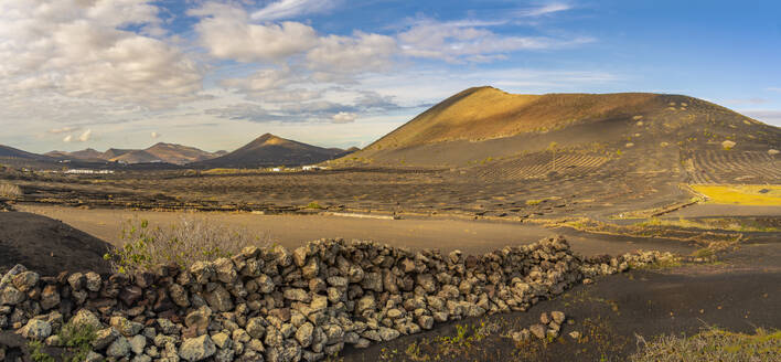 View of volcanic landscape and vineyards near La Geria, La Geria, Lanzarote, Las Palmas, Canary Islands, Spain, Atlantic, Europe - RHPLF25058