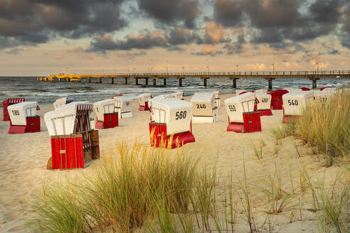 Beach chairs and pier on the beach of Bansin, Usedom Island, Baltic Sea, Mecklenburg-Western Pomerania, Germany, Europe - RHPLF25098