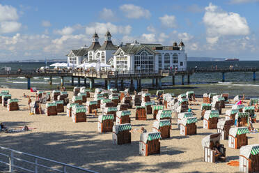 Pier and beach chairs on the beach of Sellin, Ruegen Island, Baltic Sea, Mecklenburg-Western Pomerania, Germany, Europe - RHPLF25101