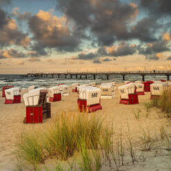 Beach chairs and pier on the beach of Bansin, Usedom Island, Baltic Sea, Mecklenburg-Western Pomerania, Germany, Europe - RHPLF25103