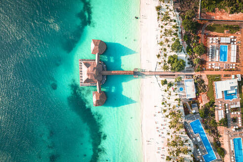 Luxury resort on white coral beach in the clear turquoise water, overhead view, Kendwa, Zanzibar, Tanzania, East Africa, Africa - RHPLF25116