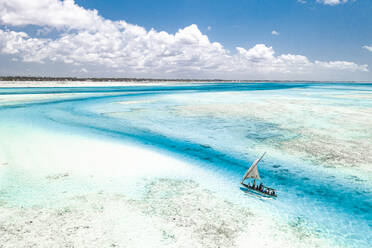 Overhead view of tourist boat on coral reef in the exotic lagoon, Paje, Jambiani, Zanzibar, Tanzania, East Africa, Africa - RHPLF25117