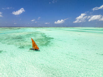 Aerial view of a dhow sailing in the transparent lagoon, Paje, Jambiani, Zanzibar, Tanzania, East Africa, Africa - RHPLF25119