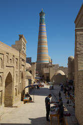 Shopping Street, Islam Khoja Minaret in the background, Ichon Qala (Itchan Kala), UNESCO World Heritage Site, Khiva, Uzbekistan, Central Asia, Asia - RHPLF25195